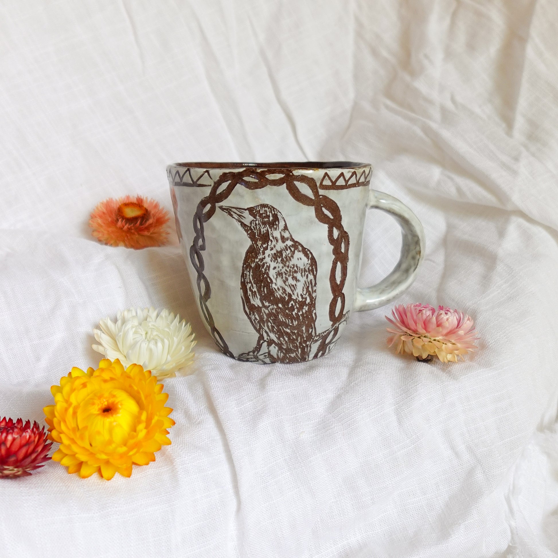carved magpie mug