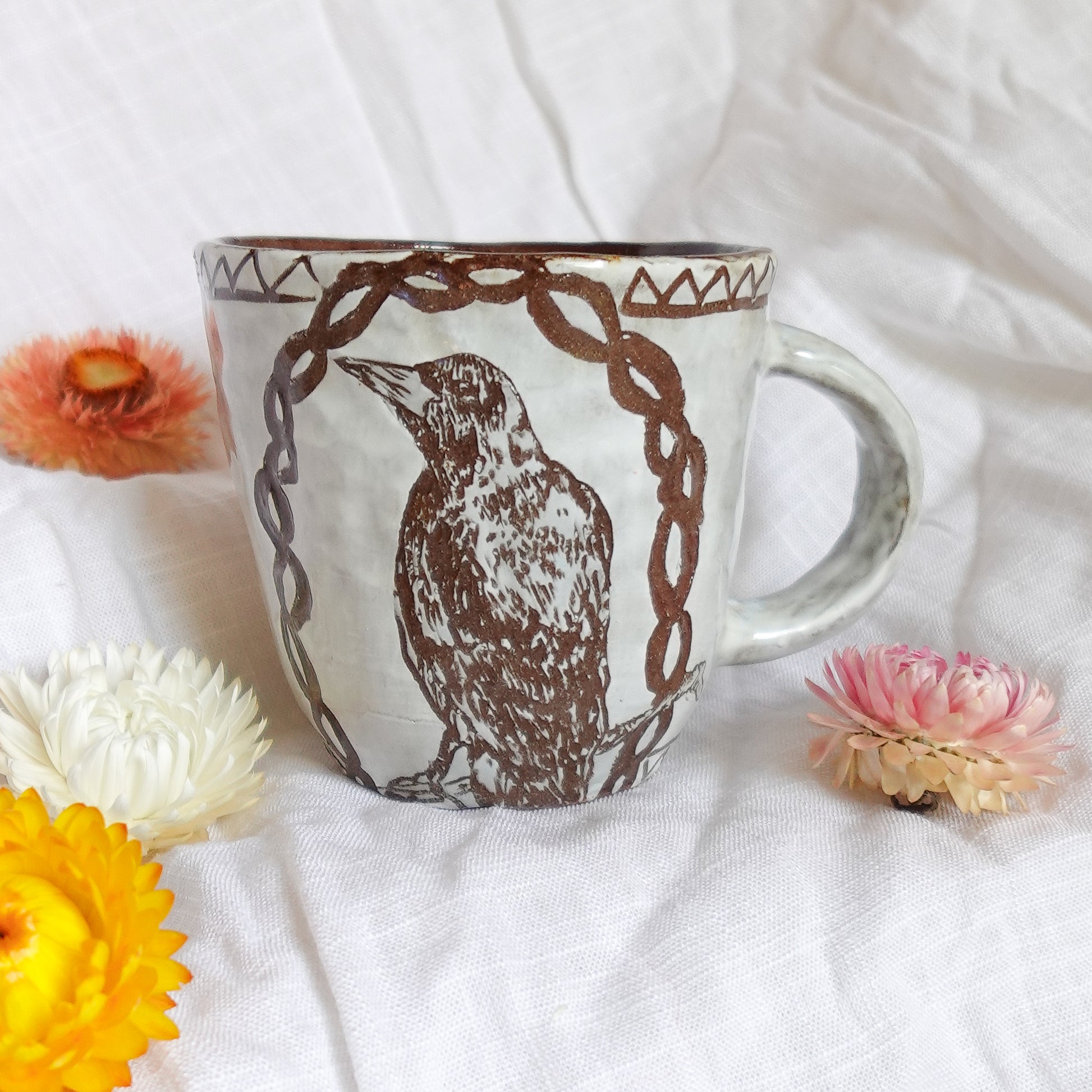 carved magpie mug