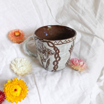 carved magpie mug
