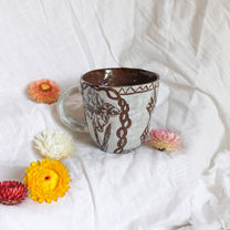 carved magpie mug
