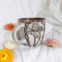 carved magpie mug