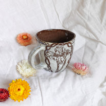 carved magpie mug