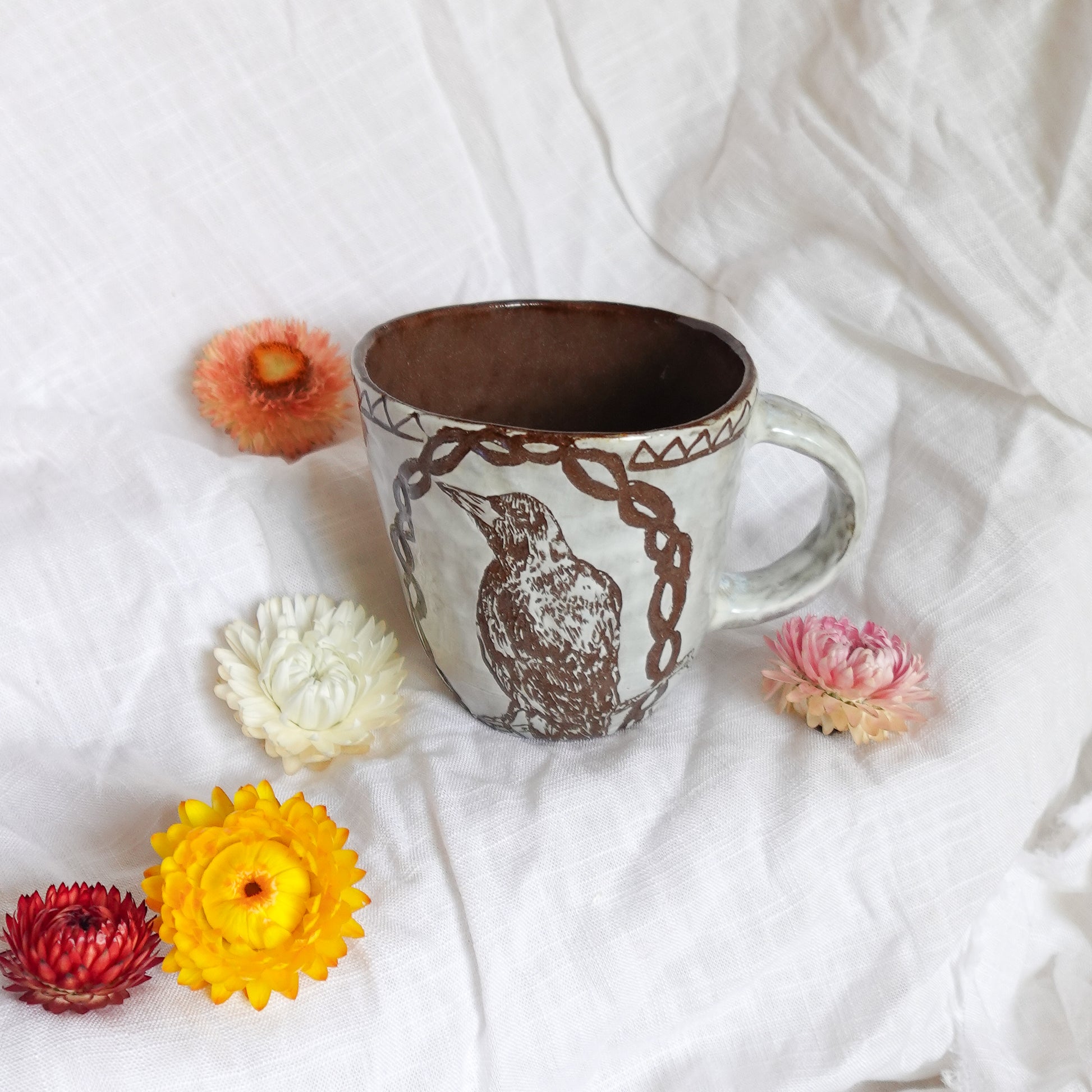 carved magpie mug