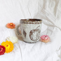 carved white apple mug