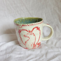 catch the hand. mug