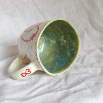 catch the hand. mug