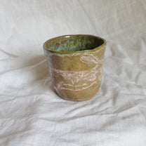 hare on a river rock. cup
