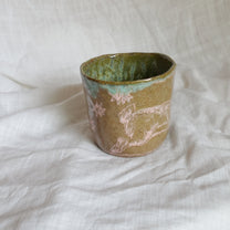 hare on a river rock. cup