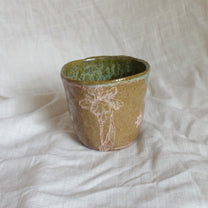 hare on a river rock. cup
