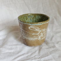 leap over. cup