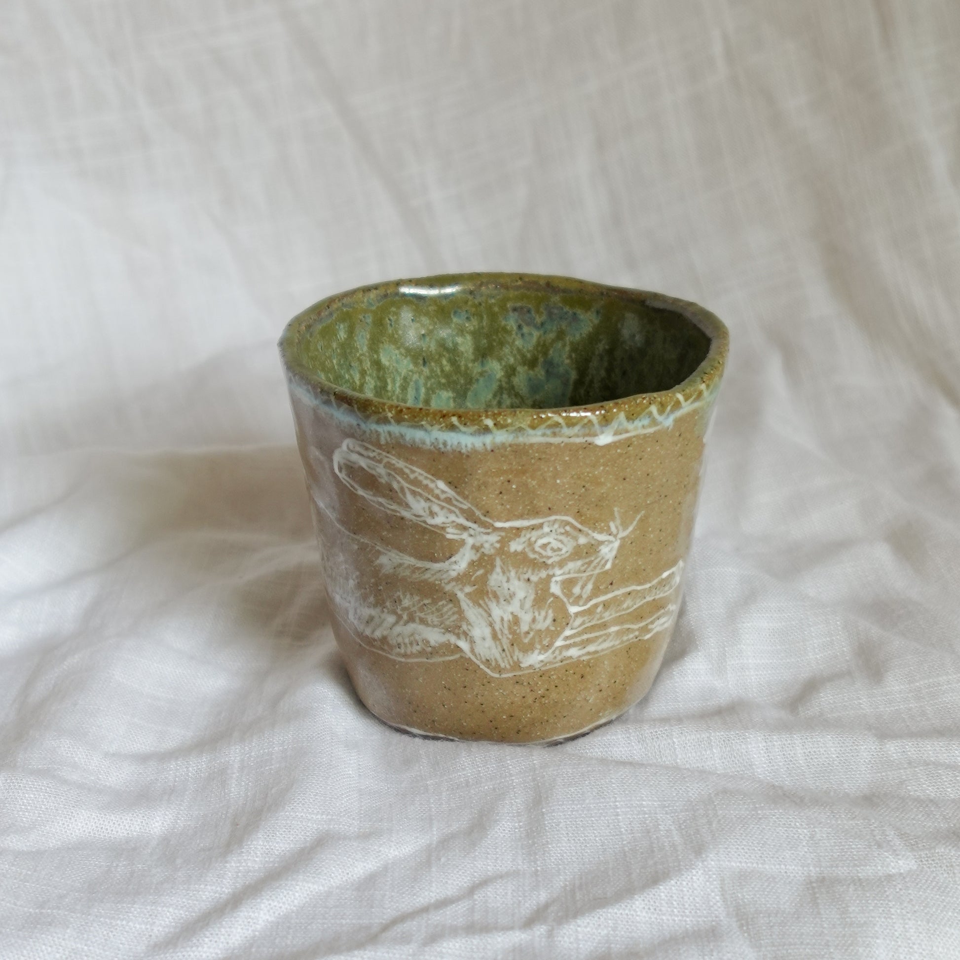 leap over. cup