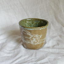 leap over. cup