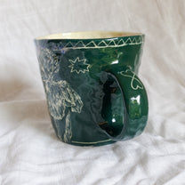 outside at evening through the window. mug