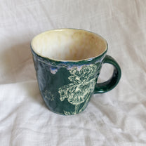 outside at evening through the window. mug