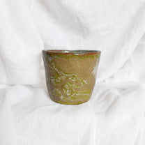 running through wet sand. cup