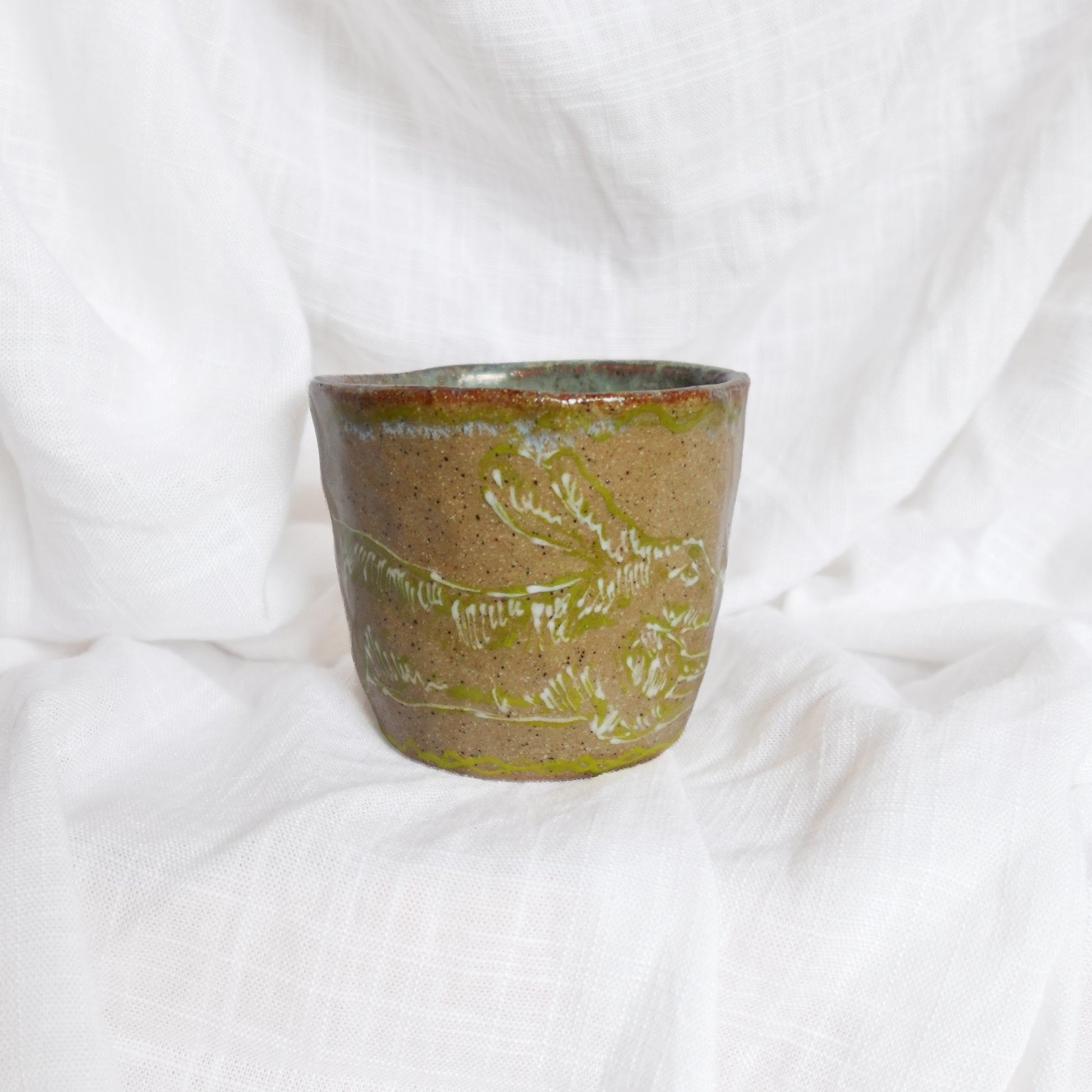 running through wet sand. cup