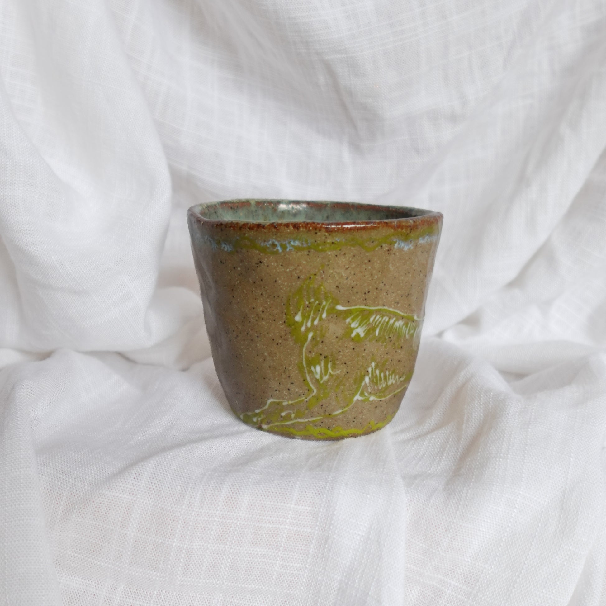 running through wet sand. cup