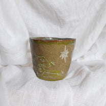 running through wet sand. cup