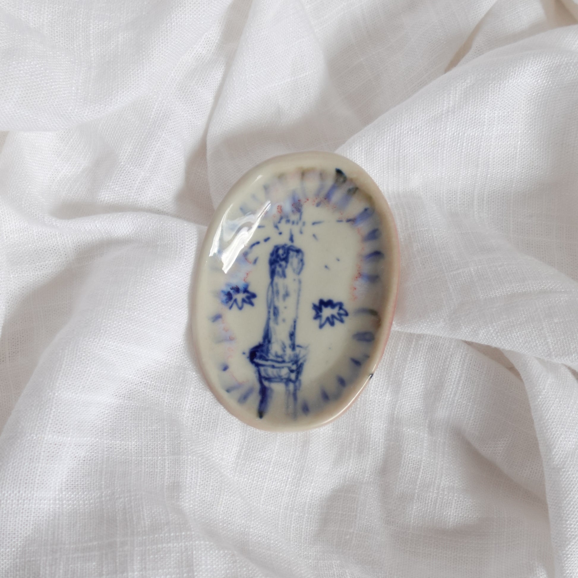 candle in the rain. trinket dish