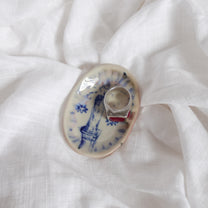 candle in the rain. trinket dish